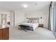 Spacious bedroom with bench and access to an outdoor balcony at 778 Horizon Canyon Dr, Henderson, NV 89052