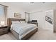 Comfortable bedroom featuring carpeted floors and a large bed with stylish striped bedding at 778 Horizon Canyon Dr, Henderson, NV 89052