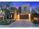 Modern two-story home with a two-car garage and well-maintained landscaping at 778 Horizon Canyon Dr, Henderson, NV 89052