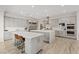 Open concept kitchen with dual islands, modern appliances, grey cabinetry, and hardwood-style flooring at 778 Horizon Canyon Dr, Henderson, NV 89052
