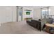 Living room featuring a comfortable gray sectional and stylish decor at 778 Horizon Canyon Dr, Henderson, NV 89052