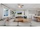 Bright living room with a large sectional sofa, modern furnishings, and natural light at 778 Horizon Canyon Dr, Henderson, NV 89052