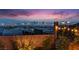 A backyard with city view with outdoor string lights creating a relaxing ambiance for a perfect evening setting at 778 Horizon Canyon Dr, Henderson, NV 89052