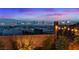 A backyard with city view with outdoor string lights creating a relaxing ambiance for a perfect evening setting at 778 Horizon Canyon Dr, Henderson, NV 89052