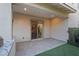 A covered patio with a large sliding glass door leading into the home, and built in granite counter with a grill at 778 Horizon Canyon Dr, Henderson, NV 89052
