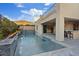 Backyard pool featuring waterfall feature and outdoor kitchen at 778 Horizon Canyon Dr, Henderson, NV 89052