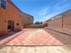Spacious backyard featuring a tiled patio area and low shrubbery at 8253 Pearl Oasis Ct, Las Vegas, NV 89139