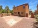 Rear exterior of a stucco house with a private, fenced backyard at 8253 Pearl Oasis Ct, Las Vegas, NV 89139
