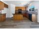 Well-lit kitchen featuring granite countertops, stylish wood cabinets, and stainless steel appliances at 8253 Pearl Oasis Ct, Las Vegas, NV 89139