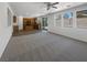 Open-concept living room and kitchen boasts plenty of natural light, modern flooring, and sliding glass door at 8253 Pearl Oasis Ct, Las Vegas, NV 89139