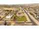 Aerial view showcases home with lush yard, sport court, pool and surrounding neighborhood at 8895 S Tenaya Way, Las Vegas, NV 89113