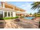 Expansive backyard with travertine patio, pool, and lush landscaping, perfect for outdoor enjoyment at 8895 S Tenaya Way, Las Vegas, NV 89113
