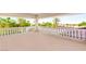 Spacious balcony with ornate white columns and balustrade overlooking lush greenery at 8895 S Tenaya Way, Las Vegas, NV 89113