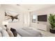 Inviting bedroom with carpet, television, and decorative art at 8895 S Tenaya Way, Las Vegas, NV 89113