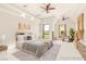 Bright staged bedroom with decorative furniture and lots of natural light at 8895 S Tenaya Way, Las Vegas, NV 89113