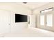 Large, brightly lit bedroom with multiple doors offering outdoor access and neutral finishes at 8895 S Tenaya Way, Las Vegas, NV 89113