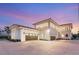 Beautiful exterior showcasing a spacious driveway and multi-car garage perfect for car enthusiasts at 8895 S Tenaya Way, Las Vegas, NV 89113