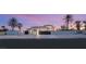A lovely desert home with a gated entrance and palm trees for a serene setting at 8895 S Tenaya Way, Las Vegas, NV 89113
