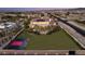 Aerial view of a spacious home with a large yard featuring a basketball court at 8895 S Tenaya Way, Las Vegas, NV 89113