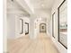 Bright foyer with white walls, wood floors, large windows and arched doorways provide elegant transitions between rooms at 8895 S Tenaya Way, Las Vegas, NV 89113