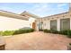 Expansive front yard with a tiled surface and well-maintained landscaping, complementing the architecture at 8895 S Tenaya Way, Las Vegas, NV 89113