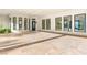 Expansive garage with travertine flooring and large windows offering ample natural light at 8895 S Tenaya Way, Las Vegas, NV 89113