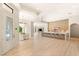 Open-concept kitchen and dining area with modern light fixtures and a seamless flow into the living space at 8895 S Tenaya Way, Las Vegas, NV 89113