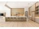 Well-lit kitchen with a large island, seating, modern cabinetry, and stainless steel appliances at 8895 S Tenaya Way, Las Vegas, NV 89113