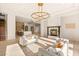 Open living area with fireplace, modern furniture, and bright natural light at 8895 S Tenaya Way, Las Vegas, NV 89113