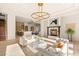 Staged living area with fireplace, modern furniture, and bright natural light at 8895 S Tenaya Way, Las Vegas, NV 89113