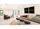 Open-concept living room with wet bar and comfortable seating at 8895 S Tenaya Way, Las Vegas, NV 89113