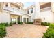 Luxurious outdoor patio with a dining table, comfortable seating, and a beautiful fireplace feature for elegant entertaining at 8895 S Tenaya Way, Las Vegas, NV 89113