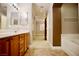 View from bathroom featuring tub and doorway to bonus room at 9144 Clear Sky Ave, Las Vegas, NV 89178