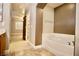 View from bathroom featuring tub and doorway to bonus room at 9144 Clear Sky Ave, Las Vegas, NV 89178