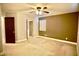 Spacious bedroom with ceiling fan, closet, and neutral color scheme at 9144 Clear Sky Ave, Las Vegas, NV 89178