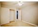 Neutral bedroom featuring carpeted floor, a ceiling fan and closet with double doors at 9144 Clear Sky Ave, Las Vegas, NV 89178