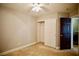 Bedroom featuring tan carpet, closet, neutral paint, and ceiling fan at 9144 Clear Sky Ave, Las Vegas, NV 89178
