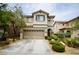 Charming two-story home featuring a well-maintained yard and attached two-car garage in a suburban neighborhood at 9144 Clear Sky Ave, Las Vegas, NV 89178