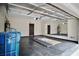 Spacious garage with epoxy floor, mounted mirror, overhead door and storage capabilities at 9144 Clear Sky Ave, Las Vegas, NV 89178