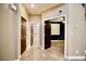 Hallway featuring neutral walls and access to bathroom and bedroom at 9144 Clear Sky Ave, Las Vegas, NV 89178