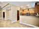 Spacious kitchen with stainless steel appliances, granite countertops, and breakfast bar at 9144 Clear Sky Ave, Las Vegas, NV 89178
