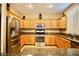 Kitchen with stainless steel appliances and light wood cabinetry at 9144 Clear Sky Ave, Las Vegas, NV 89178