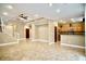 Bright and open living space featuring tile floors, a staircase, and a view into the kitchen area at 9144 Clear Sky Ave, Las Vegas, NV 89178