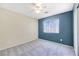 A standard bedroom featuring neutral walls, plush carpeting, and a window that offers natural light at 928 Shades End Ave, North Las Vegas, NV 89081