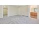 Carpeted bedroom with neutral walls, adjacent to the walk-in closet and bathroom at 928 Shades End Ave, North Las Vegas, NV 89081