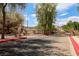 A gated community entrance with well-maintained landscaping, promising security and a welcoming atmosphere at 928 Shades End Ave, North Las Vegas, NV 89081