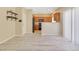 Inviting living area offering lots of natural light, wood-look floors, and kitchen access at 928 Shades End Ave, North Las Vegas, NV 89081