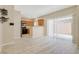 Open concept living room next to kitchen with stainless steel appliances and breakfast bar at 928 Shades End Ave, North Las Vegas, NV 89081
