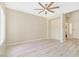 Inviting living room with wood-look floors, ceiling fan, and neutral paint at 928 Shades End Ave, North Las Vegas, NV 89081