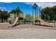 A large, fun community playground with slides and climbing equipment on a soft, shock-absorbent surface at 928 Shades End Ave, North Las Vegas, NV 89081